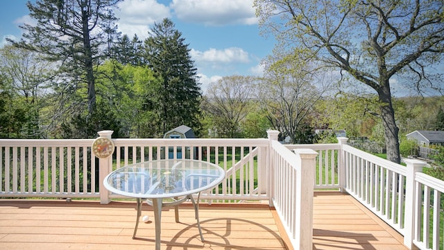 101 Parrott St, South Portland, ME 04106 - wooden terrace with a storage shed, an outbuilding, and view of scattered trees
