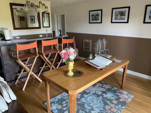 33 Latour St, Castine, ME 04421 - dining area with wood finished floors, a wainscoted wall, and an office area