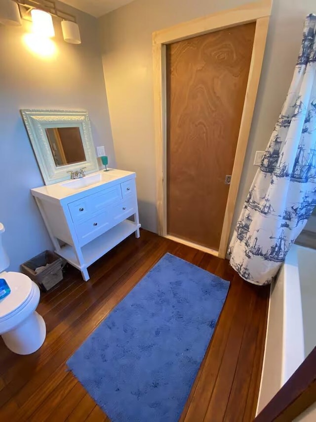 33 Latour St, Castine, ME 04421 - bathroom featuring toilet, wood finished floors, and vanity