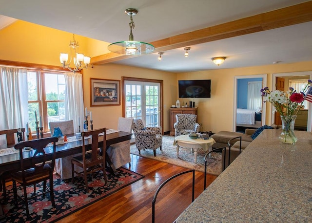 33 Latour St, Castine, ME 04421 - dining space with a chandelier, wood finished floors, and beam ceiling