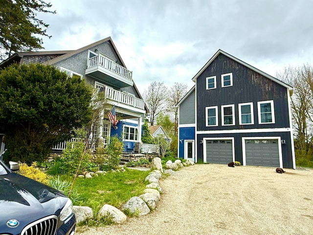 33 Latour St, Castine, ME 04421 - view of front facade with a balcony, driveway, and an attached garage