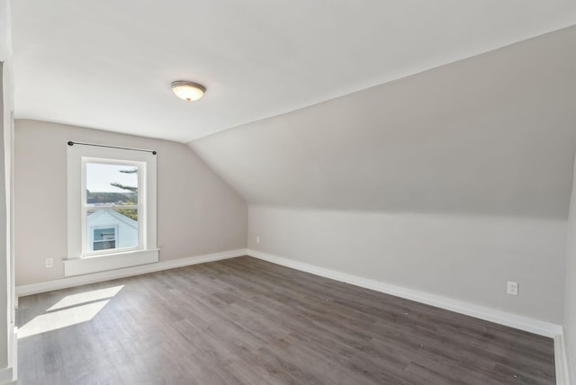 61 Granite St, Bath, ME 04530 - additional living space with wood finished floors, lofted ceiling, and baseboards