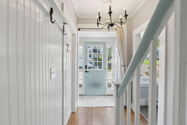 61 Granite St, Bath, ME 04530 - entrance foyer with a chandelier, ornamental molding, and marble look tiles