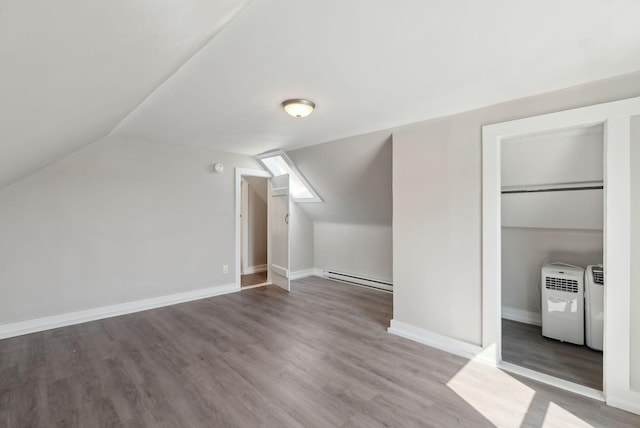 61 Granite St, Bath, ME 04530 - bonus room with baseboard heating, wood finished floors, vaulted ceiling, and baseboards