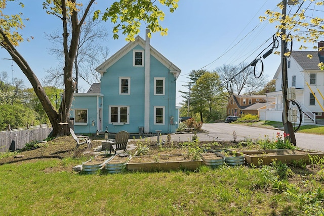 61 Granite St, Bath, ME 04530 - rear view of house with a garden