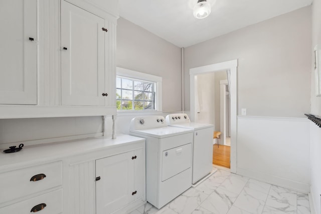 61 Granite St, Bath, ME 04530 - washroom with washer and dryer, cabinet space, and light marble finish floors