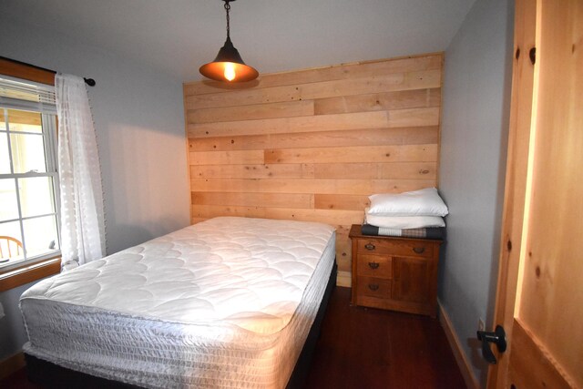 106 Shady Ln, Newport, ME 04953 - bedroom featuring dark wood finished floors and wood walls