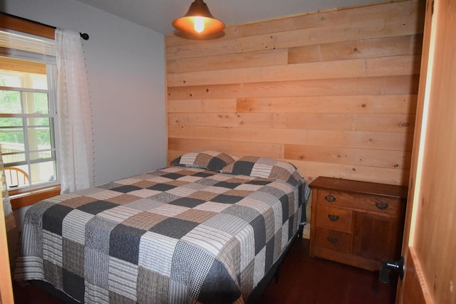 106 Shady Ln, Newport, ME 04953 - bedroom with wood walls and dark wood-style flooring