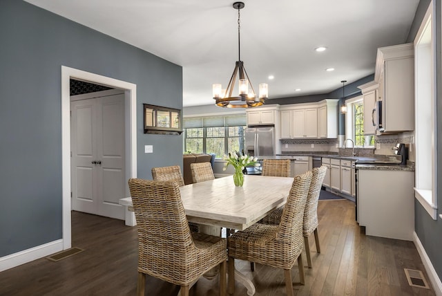 53 Ross Rd, Kennebunk, ME 04043 - dining space with a chandelier, plenty of natural light, dark wood-style flooring, and recessed lighting