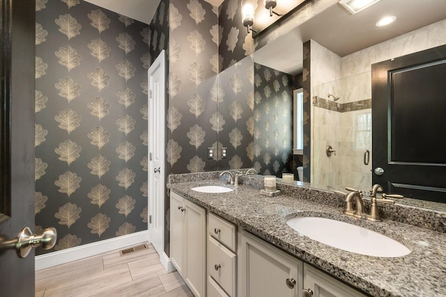 53 Ross Rd, Kennebunk, ME 04043 - full bathroom with baseboards, a stall shower, and double vanity