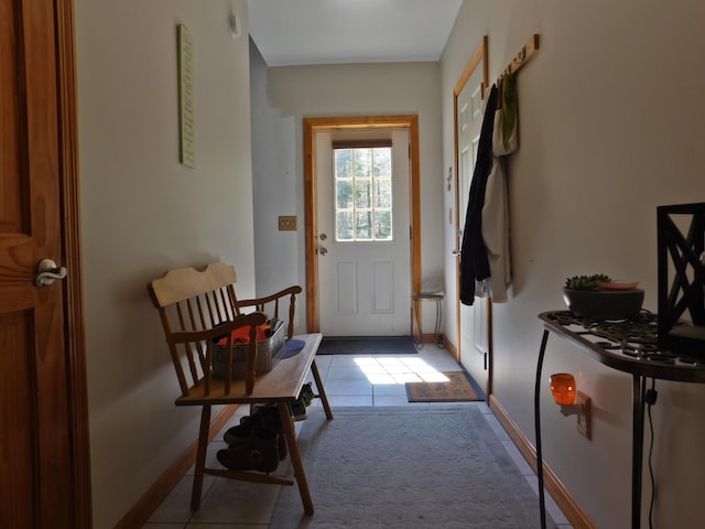 9 Hidden Dr, New Gloucester, ME 04260 - doorway to outside featuring baseboards and tile patterned flooring