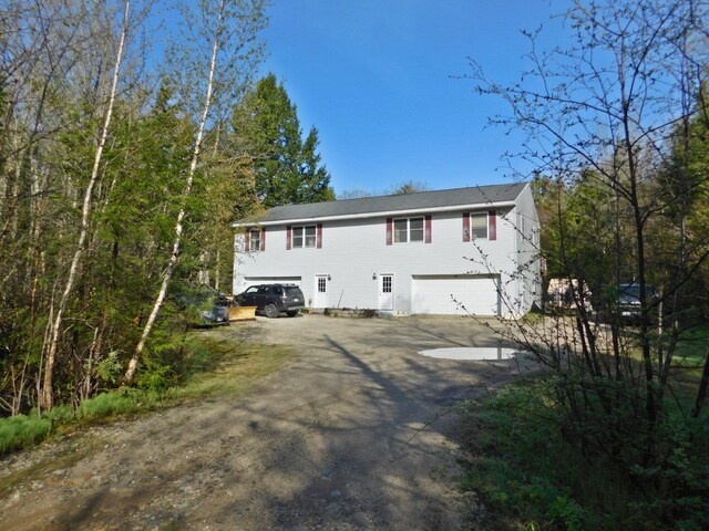 9 Hidden Dr, New Gloucester, ME 04260 - back of house featuring an attached garage and driveway