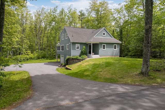 400 Chopps Cross Rd, Woolwich, ME 04579 - view of front of house featuring roof with shingles, asphalt driveway, an attached garage, and a front yard