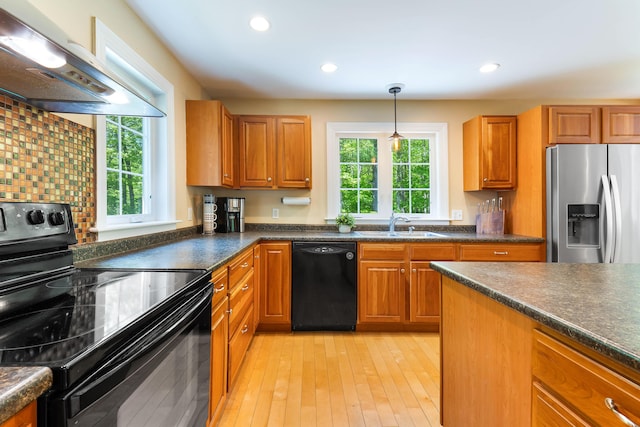 400 Chopps Cross Rd, Woolwich, ME 04579 - kitchen with black appliances, extractor fan, healthy amount of natural light, dark countertops, and recessed lighting