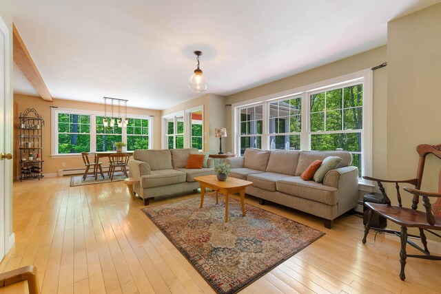 400 Chopps Cross Rd, Woolwich, ME 04579 - living room with light wood-type flooring and a baseboard heating unit