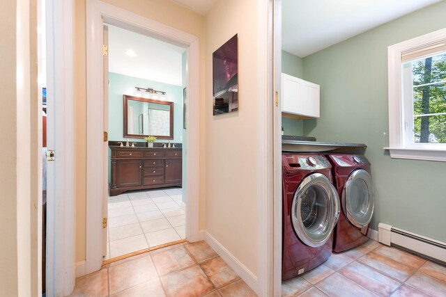 400 Chopps Cross Rd, Woolwich, ME 04579 - washroom with a baseboard heating unit, cabinet space, independent washer and dryer, light tile patterned floors, and baseboards