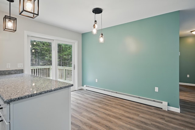 457 S Reynolds Rd, Winslow, ME 04901 - kitchen featuring a baseboard heating unit, wood finished floors, decorative light fixtures, baseboards, and stone countertops