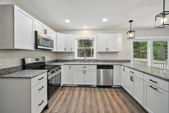 457 S Reynolds Rd, Winslow, ME 04901 - kitchen featuring stainless steel appliances, a sink, plenty of natural light, white cabinetry, and recessed lighting