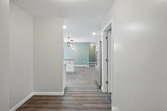 457 S Reynolds Rd, Winslow, ME 04901 - corridor with baseboard heating, baseboards, wood finished floors, and recessed lighting