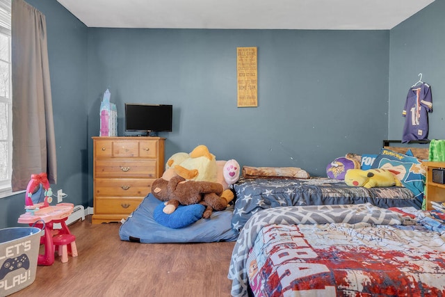 37 Birchwood Ln, Bowdoinham, ME 04008 - bedroom featuring wood finished floors and baseboard heating