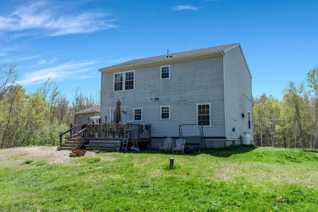 37 Birchwood Ln, Bowdoinham, ME 04008 - back of property with a lawn and a deck