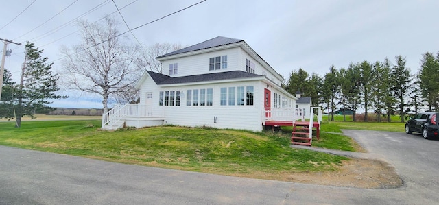 281 Cross Rd, Washburn, ME 04786 - traditional-style house featuring a front lawn and a deck
