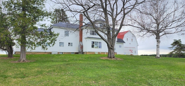 281 Cross Rd, Washburn, ME 04786 - view of property exterior featuring a chimney and a lawn