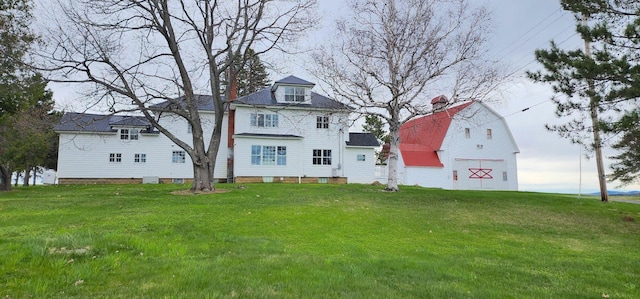 281 Cross Rd, Washburn, ME 04786 - back of property with a lawn, a barn, and an outbuilding