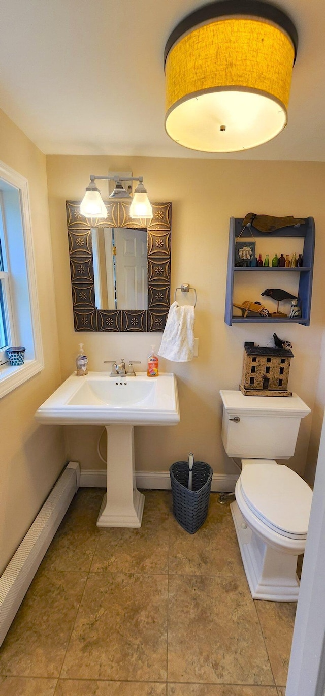 281 Cross Rd, Washburn, ME 04786 - bathroom with toilet and baseboards