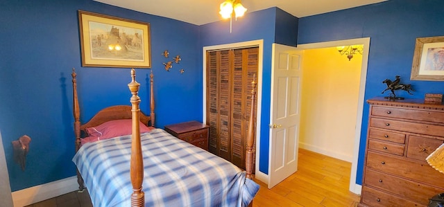 281 Cross Rd, Washburn, ME 04786 - bedroom featuring baseboards, wood finished floors, and a closet