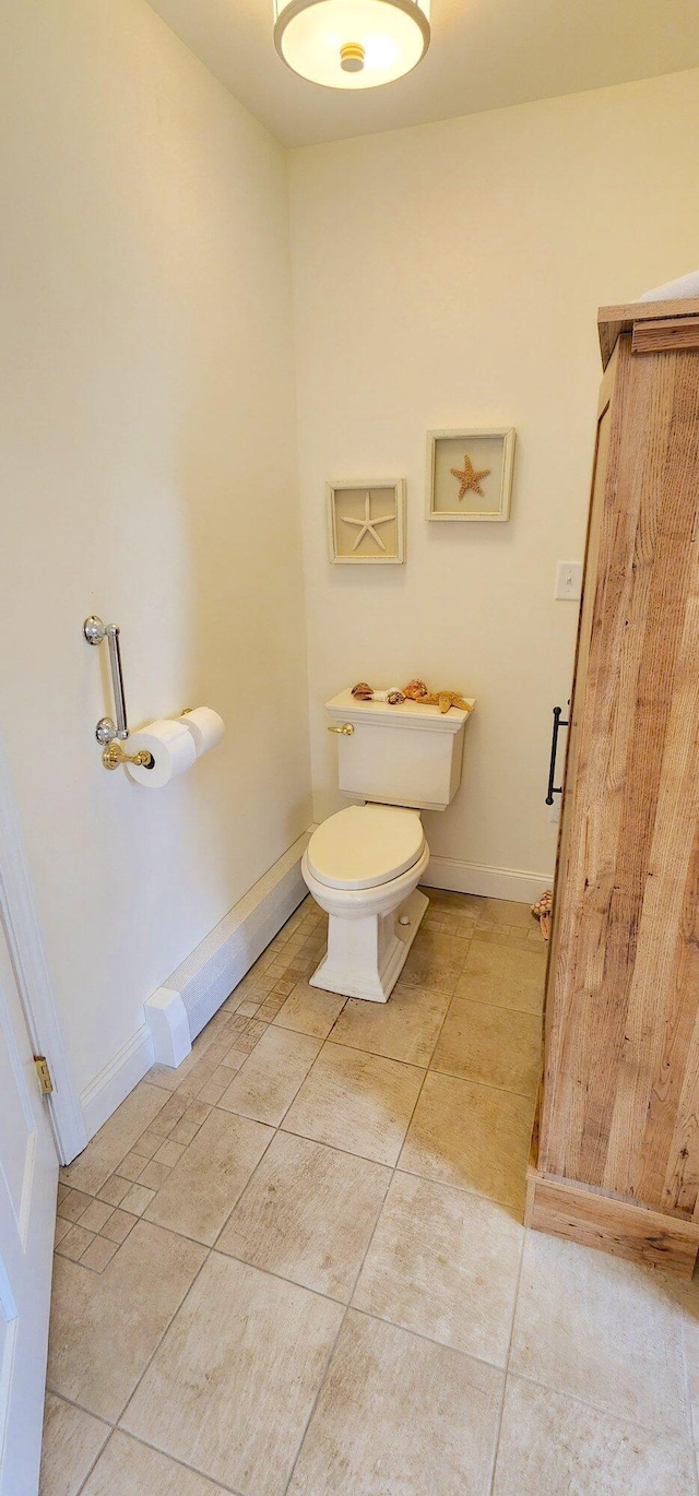281 Cross Rd, Washburn, ME 04786 - bathroom with tile patterned flooring, toilet, and baseboards