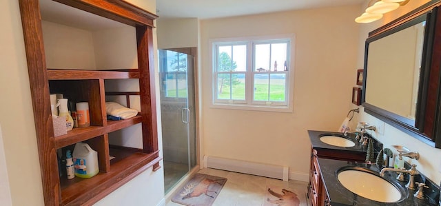 281 Cross Rd, Washburn, ME 04786 - bathroom featuring a baseboard heating unit, a shower stall, double vanity, and baseboards