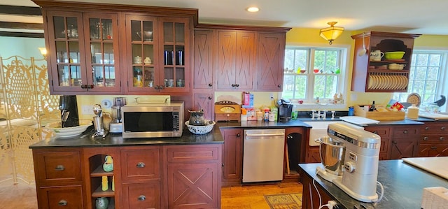 281 Cross Rd, Washburn, ME 04786 - kitchen featuring stainless steel appliances, open shelves, dark countertops, glass insert cabinets, and recessed lighting