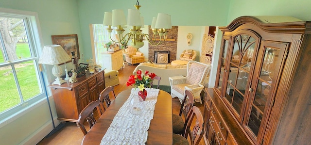 281 Cross Rd, Washburn, ME 04786 - dining space with wood finished floors and a fireplace