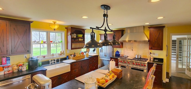 281 Cross Rd, Washburn, ME 04786 - kitchen with wall chimney exhaust hood, premium appliances, recessed lighting, a sink, and backsplash