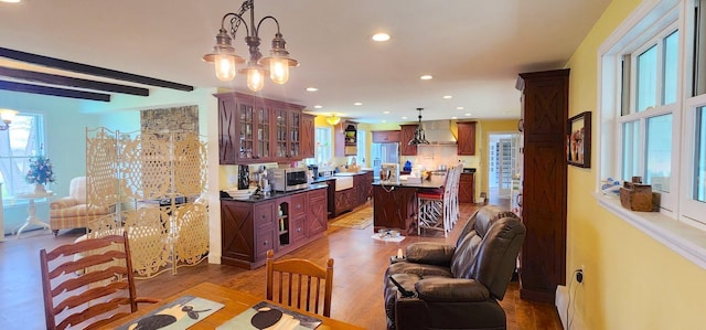 281 Cross Rd, Washburn, ME 04786 - dining area with plenty of natural light, recessed lighting, wood finished floors, and beamed ceiling