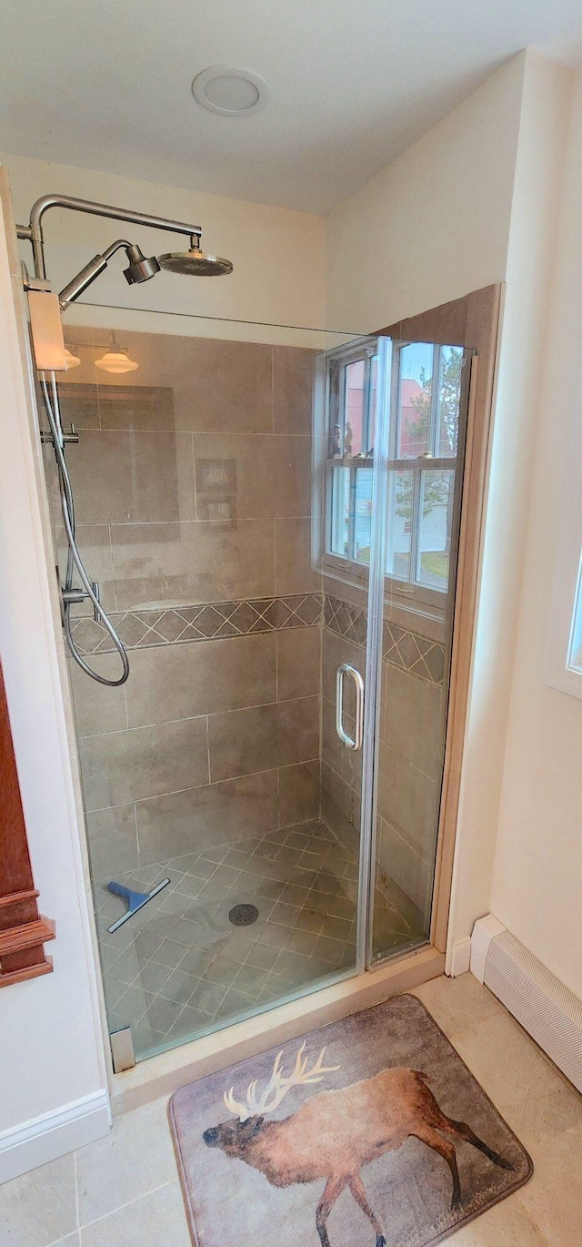 281 Cross Rd, Washburn, ME 04786 - bathroom featuring a shower stall, tile patterned floors, and baseboards