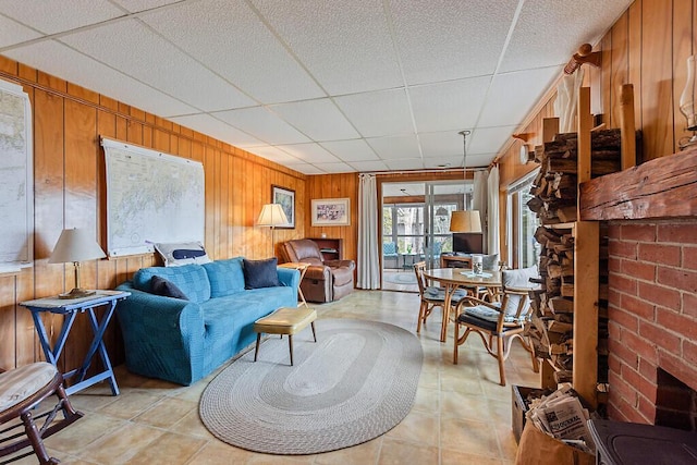 165 Mcfarland Shore Rd, Bristol, ME 04554 - living area featuring wooden walls and a drop ceiling