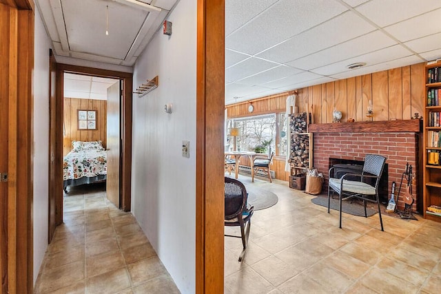 165 Mcfarland Shore Rd, Bristol, ME 04554 - hallway with wooden walls, attic access, healthy amount of natural light, and a drop ceiling