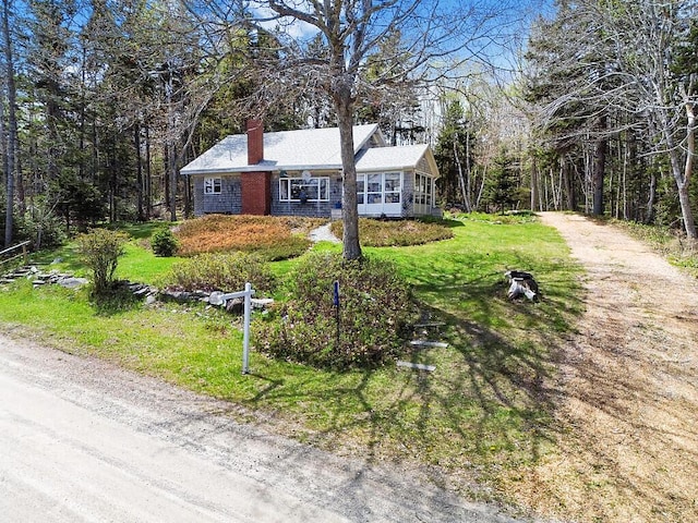 165 Mcfarland Shore Rd, Bristol, ME 04554 - view of front of property with a chimney, a front lawn, and dirt driveway