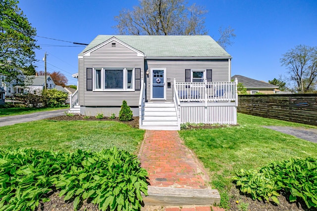 301 Sherwood St, Portland, ME 04103 - bungalow-style house featuring a shingled roof and a wooden deck