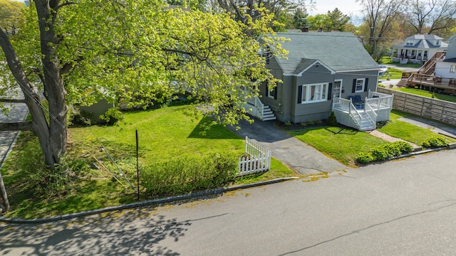 301 Sherwood St, Portland, ME 04103 - view of front facade featuring a shingled roof and a chimney