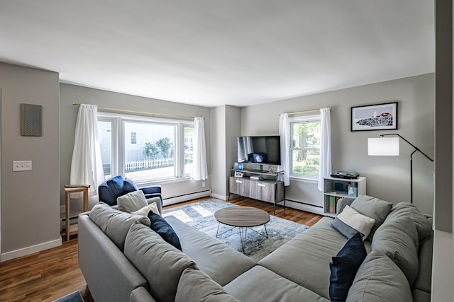 301 Sherwood St, Portland, ME 04103 - living area featuring a baseboard radiator, plenty of natural light, and wood finished floors