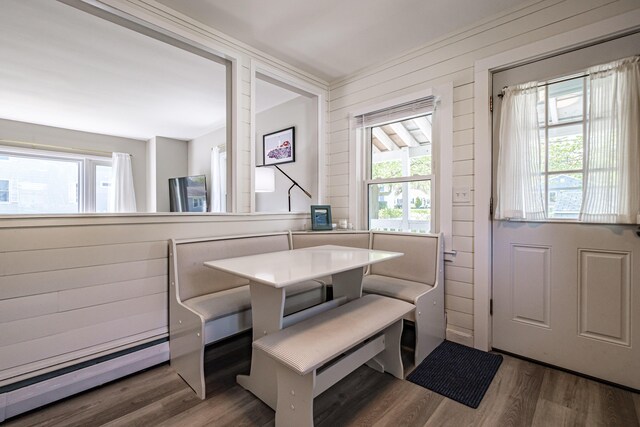 301 Sherwood St, Portland, ME 04103 - dining space featuring a baseboard radiator and wood finished floors