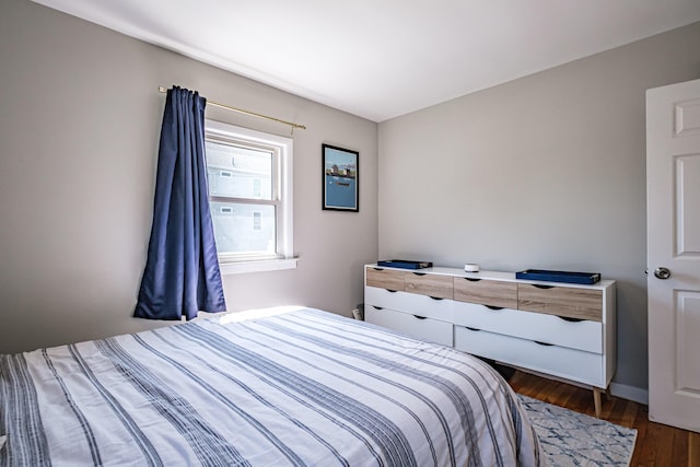 301 Sherwood St, Portland, ME 04103 - bedroom featuring dark wood-type flooring and baseboards