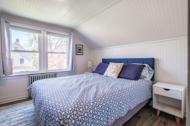 301 Sherwood St, Portland, ME 04103 - bedroom featuring radiator heating unit, wood finished floors, and lofted ceiling
