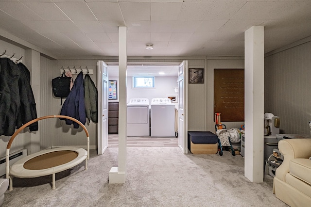 301 Sherwood St, Portland, ME 04103 - below grade area featuring washing machine and dryer, carpet floors, and a baseboard heating unit
