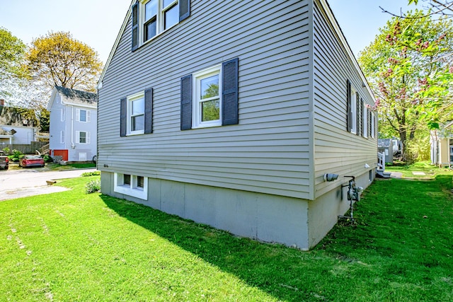 301 Sherwood St, Portland, ME 04103 - view of side of home featuring a lawn
