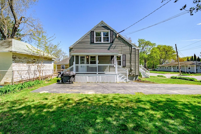 301 Sherwood St, Portland, ME 04103 - back of house featuring a yard and covered porch