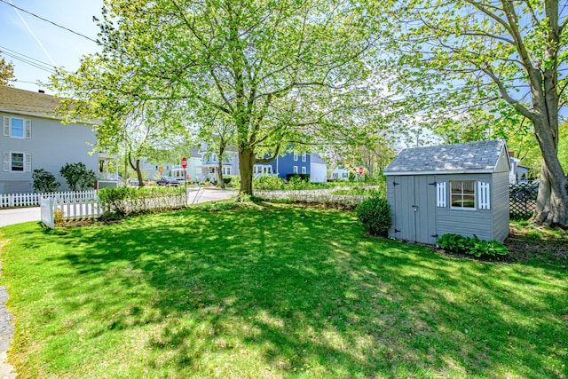 301 Sherwood St, Portland, ME 04103 - view of yard featuring a storage unit, an outbuilding, and a residential view